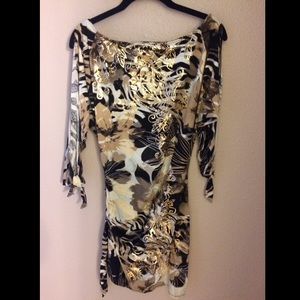 Gorgeous Cache dress with arm cutouts