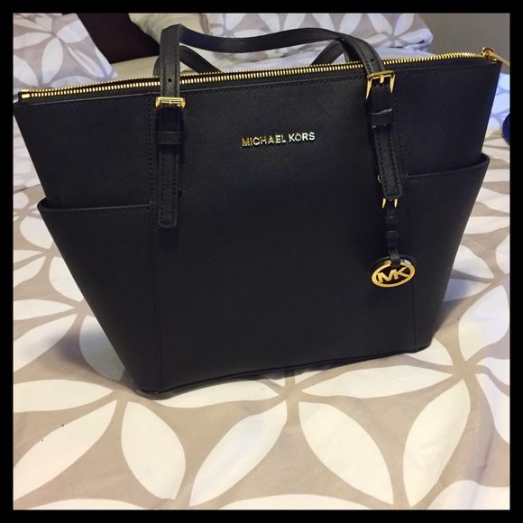 Michael Kors Handbags - NWT East West Mk tote bag