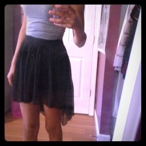 Black pleated high-low skirt