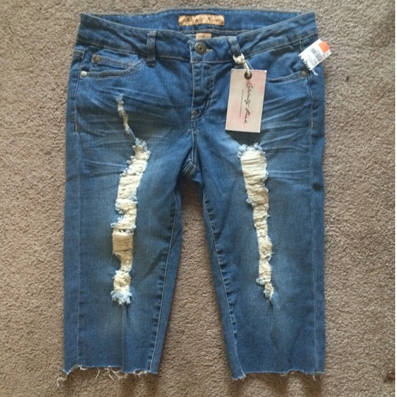 Celebrity pink ripped knee length jeans