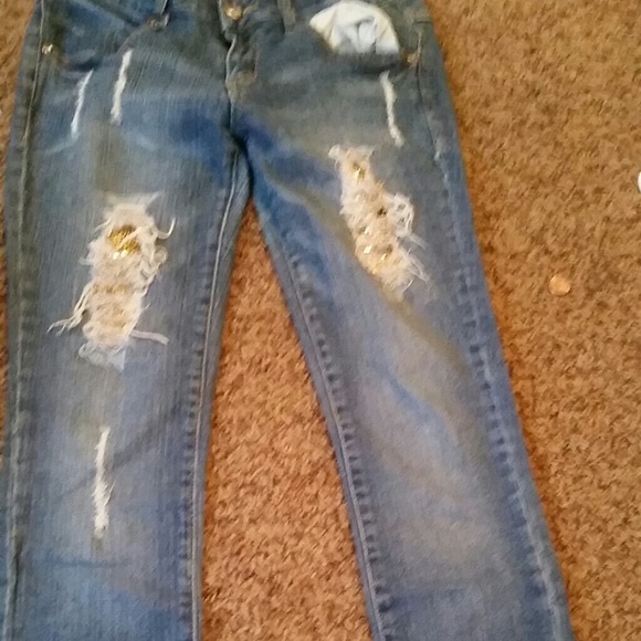 Ripped Jeans with a gem background