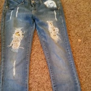 Ripped Jeans with a gem background