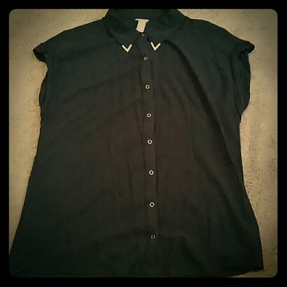 Black shirt with gold buttons and collar tips