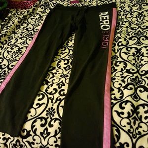 Black sweatpants with pink line down the sides