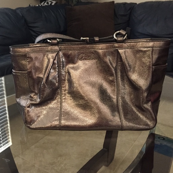A metallic authentic coach purse.