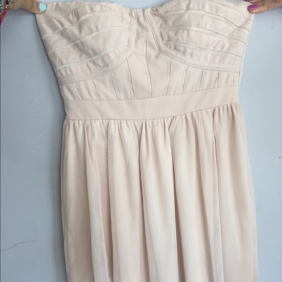 Mini nude strapless dress.