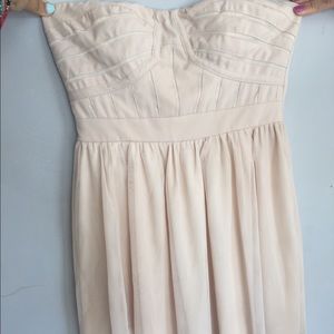 Mini nude strapless dress.