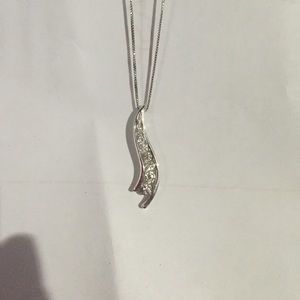 Slight S shaped diamond necklace