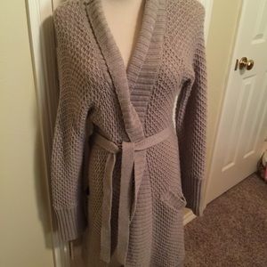 Cable knit long sweater jacket.