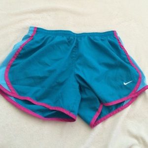 Blue and pink nike running shorts
