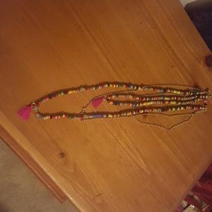 Beaded necklace layered  with gold chains