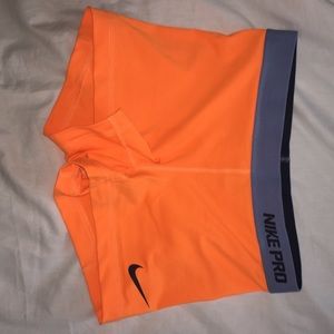 Orange Nike pros