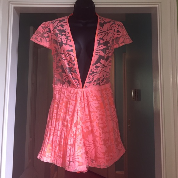 Gently used coral lace romper with lining.