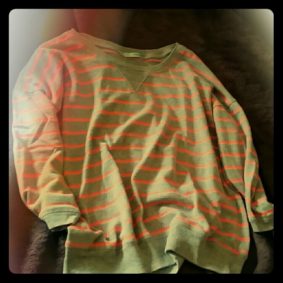 Grey and pink striped medium sleeve shirt.