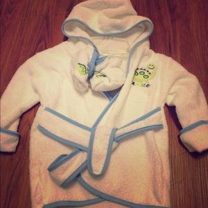 Baby robe, white with baby blue trim.