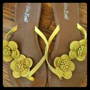 Yellow floral flip flops