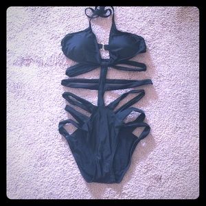 Black caged one piece bathing suit....NEVER WORN!!