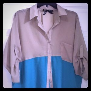 Beige/turquoise color block blouse.
