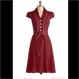 "About the artist" dress in brick