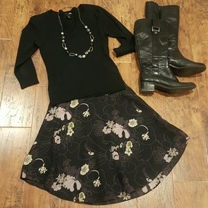 Black skirt with lavender flower pattern.