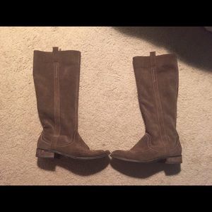 Brown riding boots.