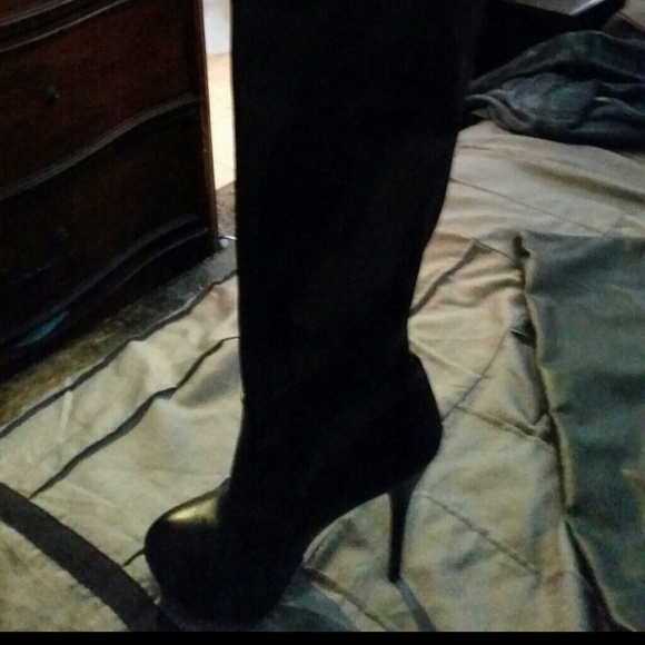Thigh length black boots heels