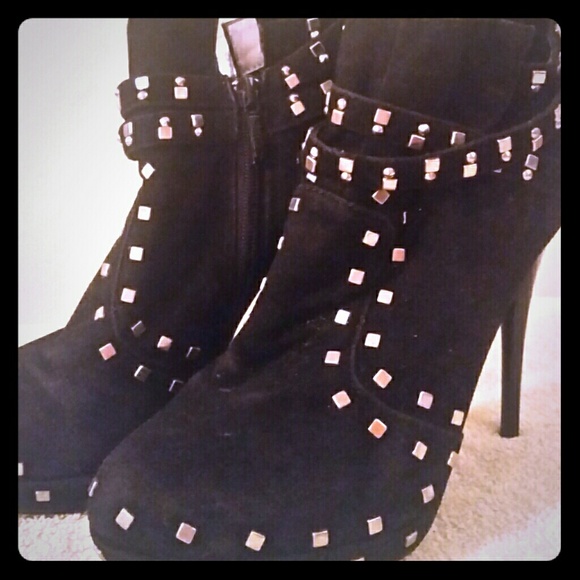 Black high heel booties with silver stud accents
