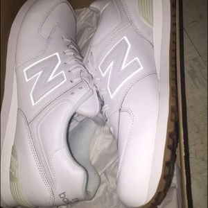 All white New Balances size 10.5 in men