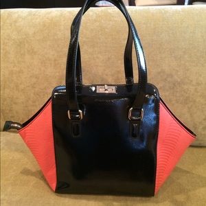 Mellie Bianco Faux pink snake and black handbag