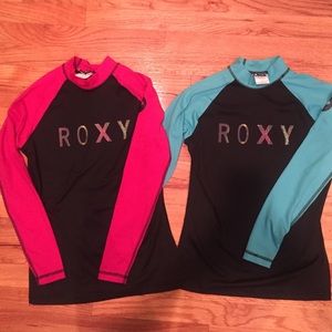 Surf's up with these Roxy rash guards!