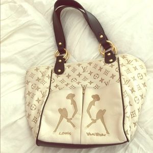 White and gold logo bucket bag