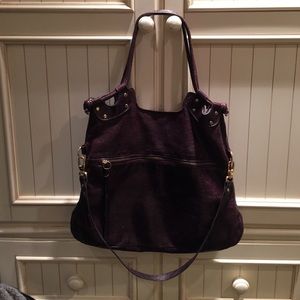 Purple leather handbag