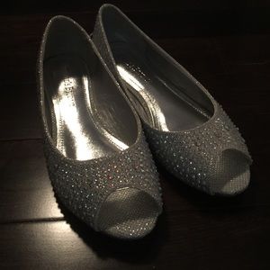 Silver flats with a small heel.