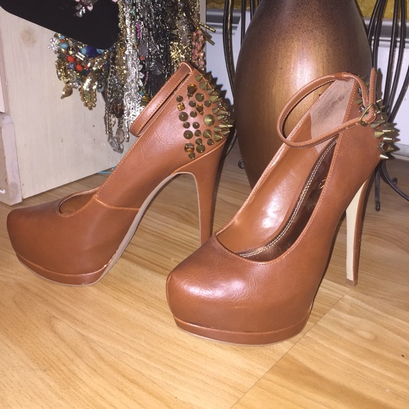 Brown ankle strap spiked embedded platform heels
