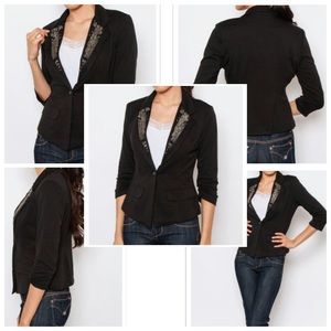 Sleek fitted black blazer with bead accents