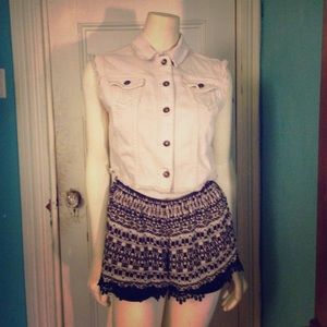 Light pink sleeveless denim jacket