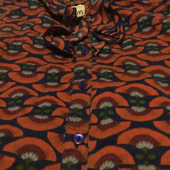 A printed tank top. It buttons up in the front. - Picture 3 of 3