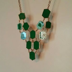 Bib necklace with green pendants