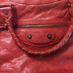 Balenciaga red shoulder bag.