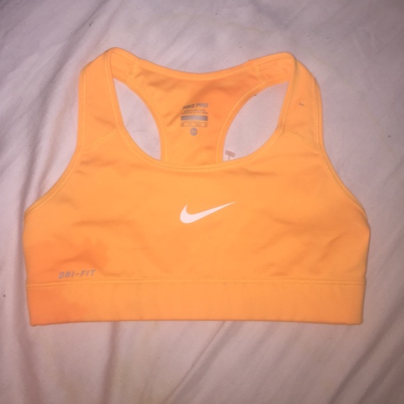 Bright orange Nike sports bra.