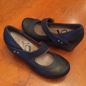 OTBT black and navy wedge heel shoes.