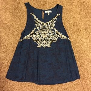 Tank top blouse with stitched design on front
