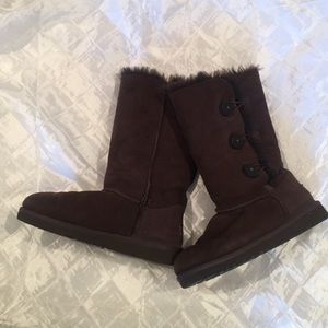 Tall brown Uggs with buttons on the side!