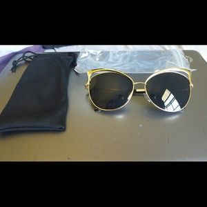 Black and gold cat eye sunglasses