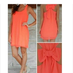 Orange short dress with bow in the back