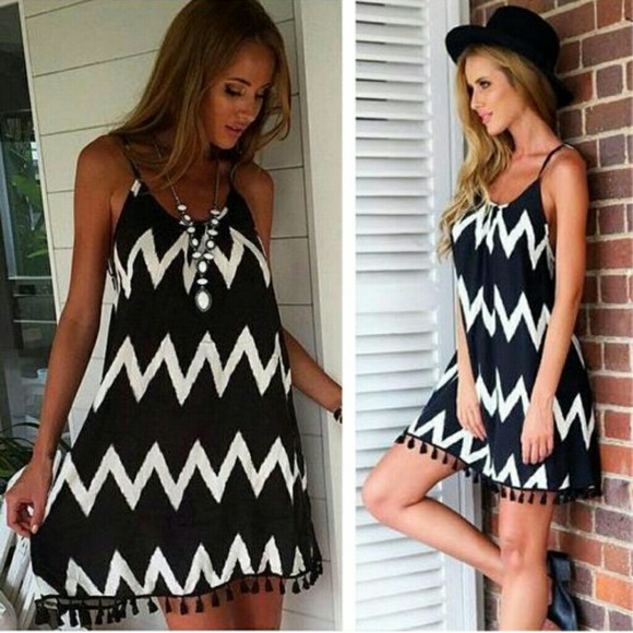 Trapeze dress. Open and straps in the back chevron