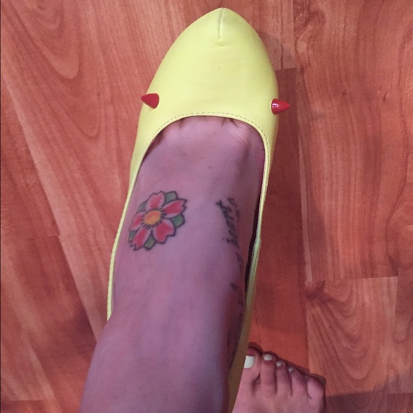 Fluorescent yellow pumps with red devil ears