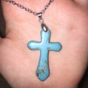 Rustic looking turquoise cross necklace.