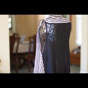 Sleeveless flowing sweater