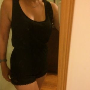 Small black romper w/lace. New without tags
